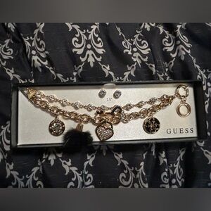 Guess  lose angels  bracelet with matching earrings set